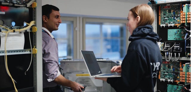 Two people with a computer