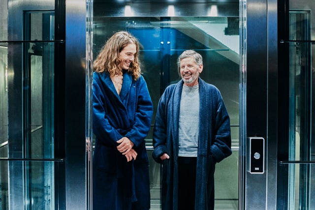 man and woman in an elevator