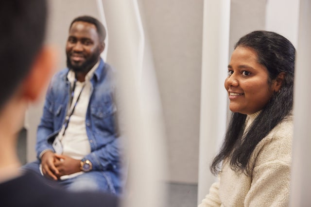 A man and a woman in a meeting.