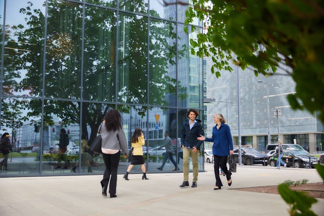 Man and woman walking in a city. 