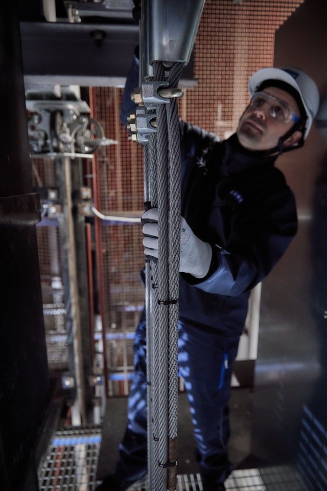 KONE technician repairing elevator