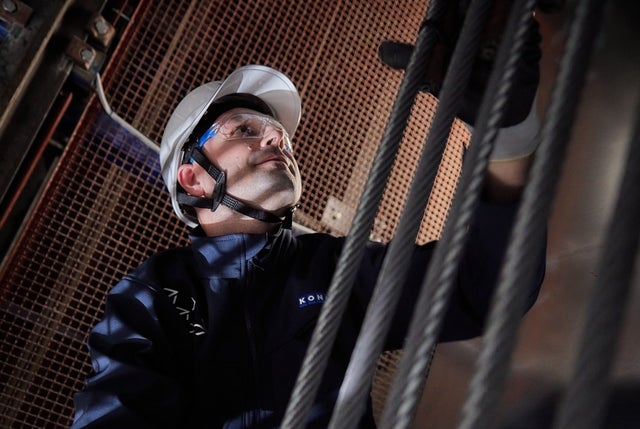 KONE technician working on an elevator