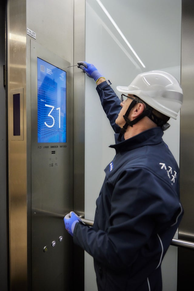 KONe technicial working on an elevator