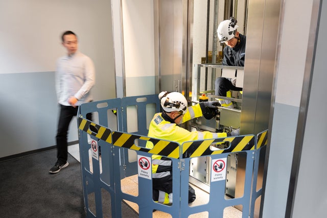 KONE technicians working on an elevator