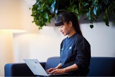 Woman looking at laptop
