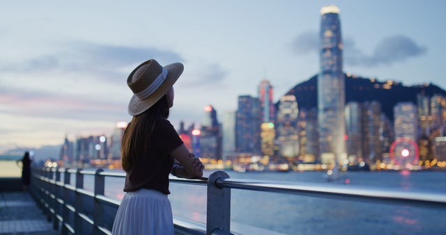 A woman looking at a city skyline